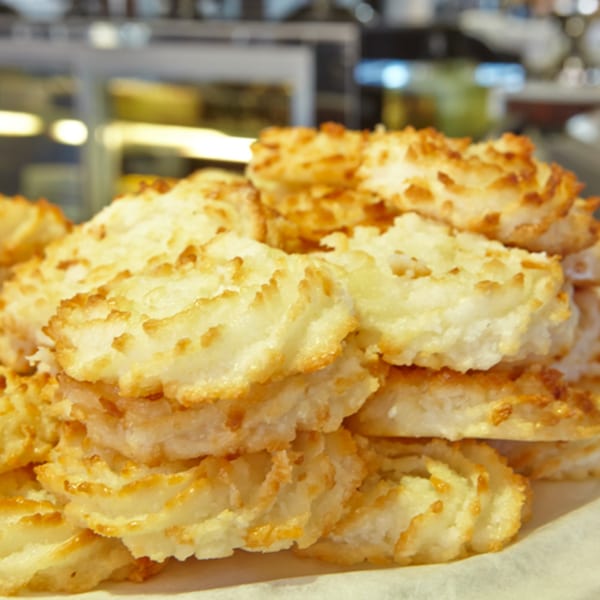 A close-up of a pile of golden-brown coconut macaroons from Jax Inn Diner.